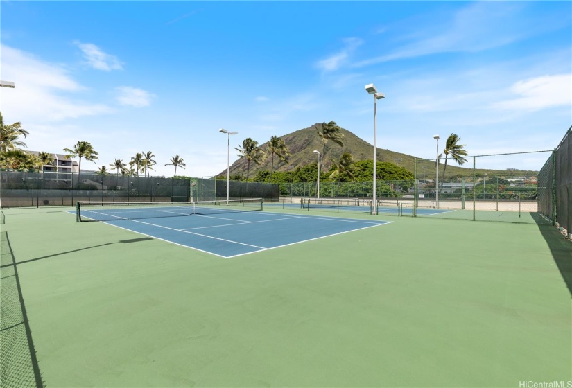 The tennis courts.  Lights allow games into the evening.   There is also a hitting wall for practice or handball.  Koko  Crater watches over it all.