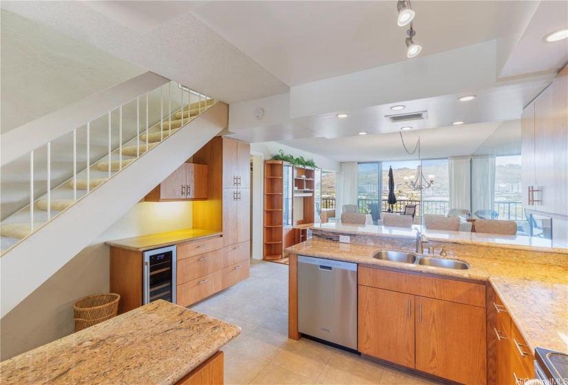 Kitchen was expanded to bar area and storage under the staircase to the second floor.