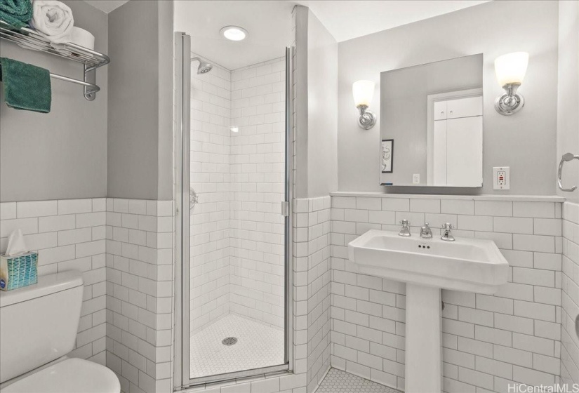 Second bathroom fully renovated with lovely subway tile and pedestal sink