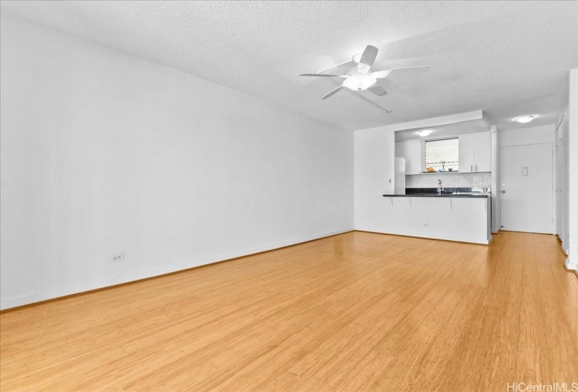 Living area unstaged.   Beautiful bamboo hardwood floors. Freshly painted.