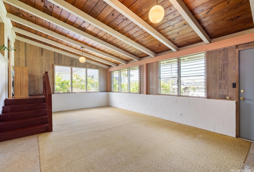 High ceilings for that feel of space and volume.  Natural wood ceiling adds to the rustic charm.