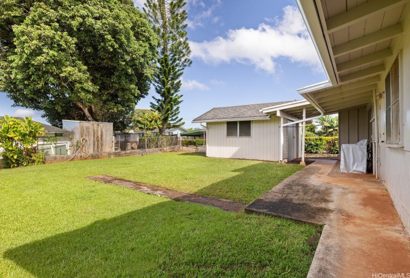 The yard is manicured and has room to expand the home.  Separate workman's shed in picture.