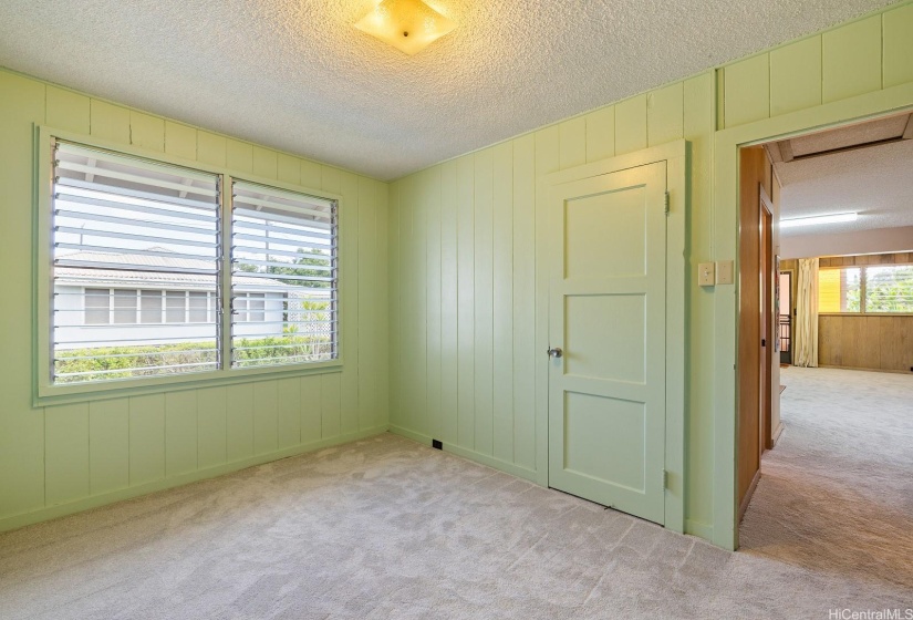 interior bedroom.  Freshly painted in a serene green hue.