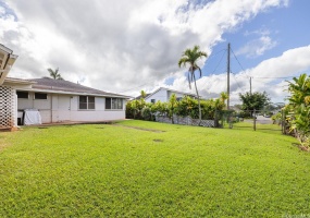 Those double gates lead to a shared private roadway to the backside of the home.