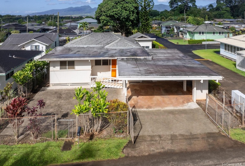 Fence can be removed in front to access the concrete pad for more parking. Perfect for your own pickleball court.