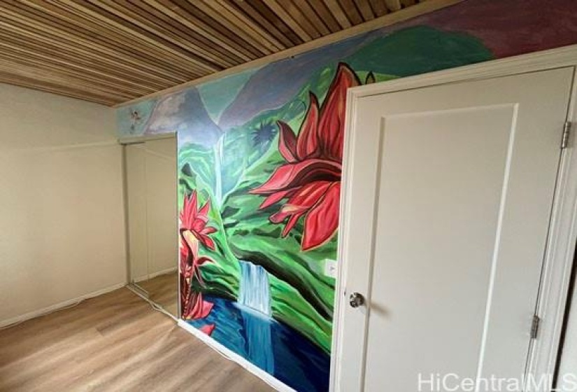 A beautiful hand painted mural brings the outside in on the second bedroom wall... 1875 KALANIANAOLE AVE, #311