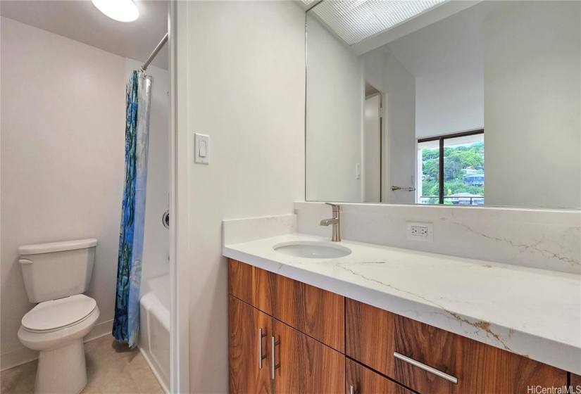 Master bath with new cabinets, countertops and reglazed tub