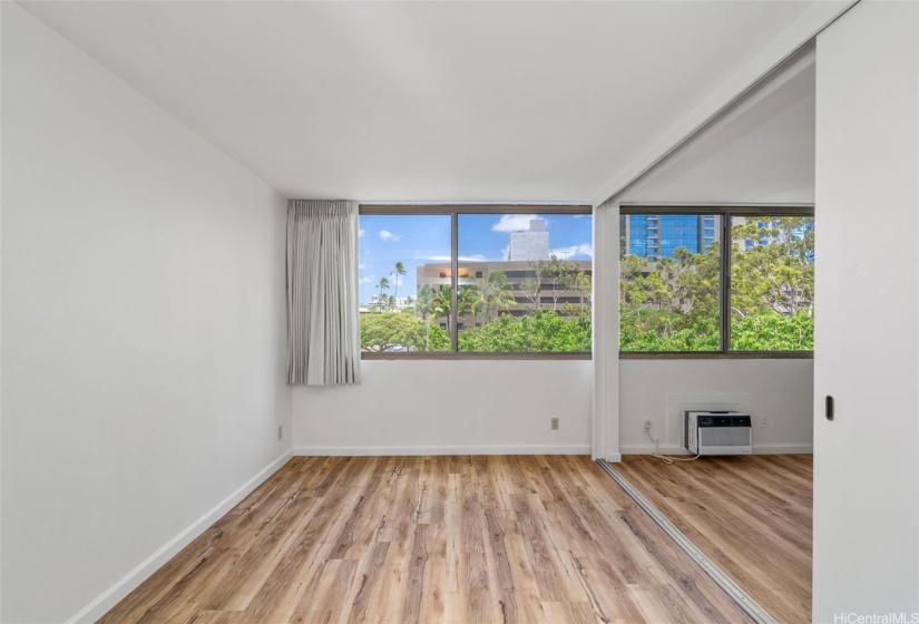 Spacious bedroom with large windows