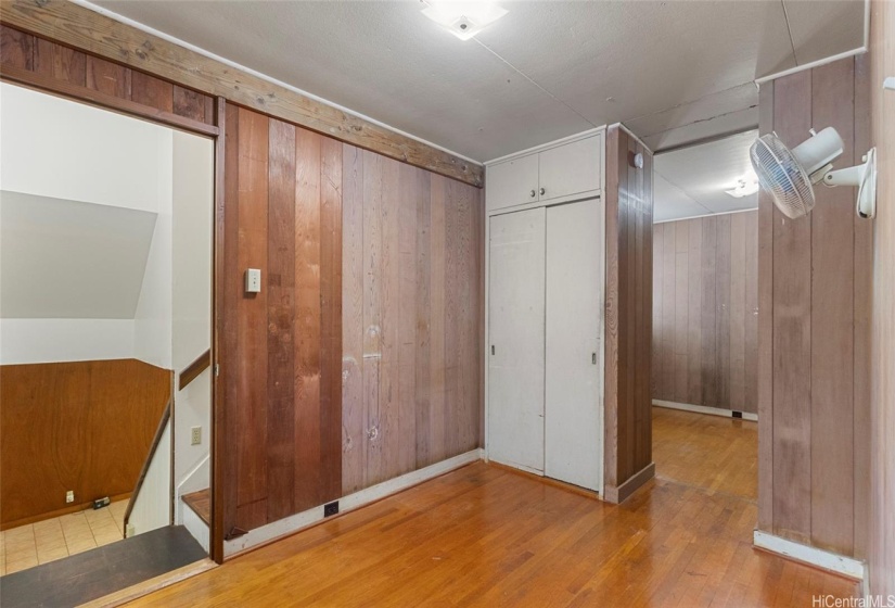 Bedroom #4 in the main house with internal access stairways between the upstairs and downstairs additions