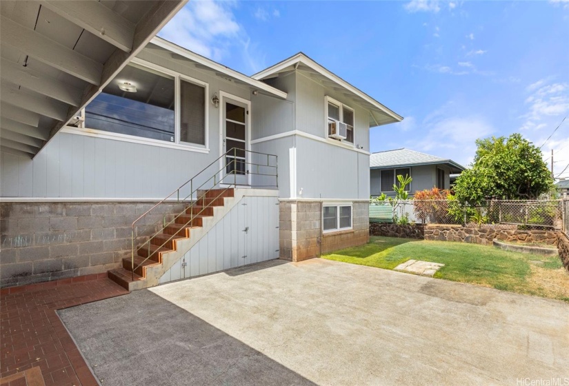 Entrance #2 into the main house with ample parking on the lot