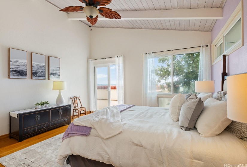 This bedroom has access to the large outdoor lanai space that wraps around 3/4 of the upstairs.