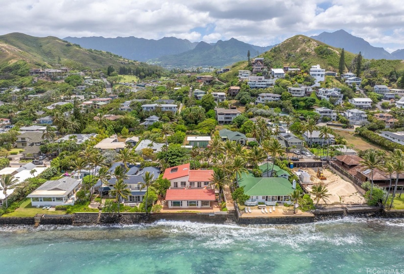 Peaking out past every neighbor, this grandfathered in view has withstood nature's seasons with its solid stucco walls and red-tiled roof. Notice Olomana (Three Peaks) looking over this happy hale.