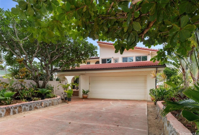 Plenty of parking with a 2 car garage and spacious driveway inside the secured electric gate.