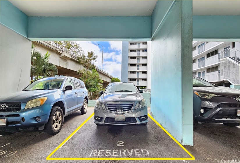 The parking stall is across from the stairwell, which leads to this corner unit. There is an elevator as well.