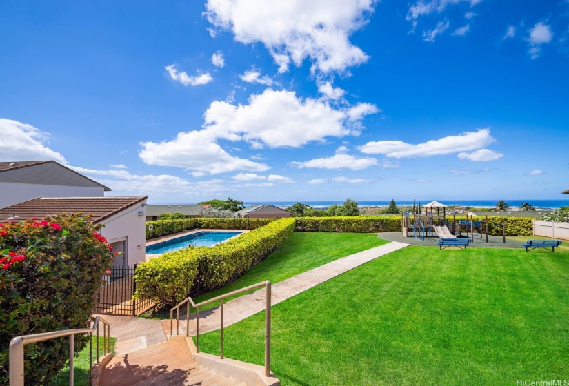 Breathtaking ocean views overlooking the community pool and kids play area.