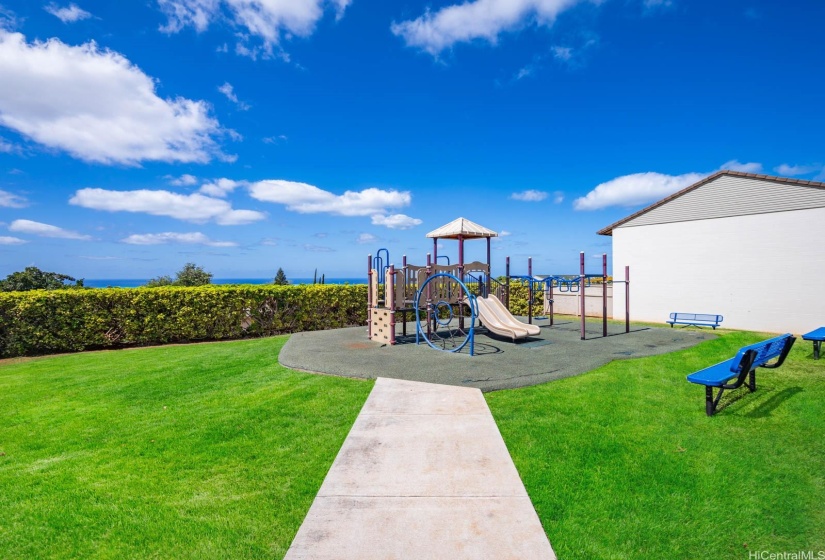 Breathtaking ocean views overlooking the community pool and kids play area.