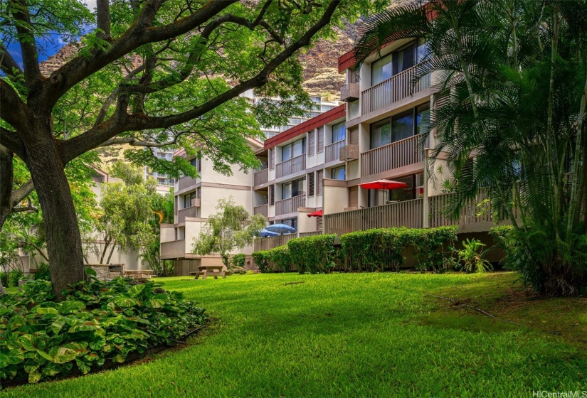 Welcome to Makaha Valley Plantations!  This ground floor unit (w/ red umbrella) is the perfect place to call home.