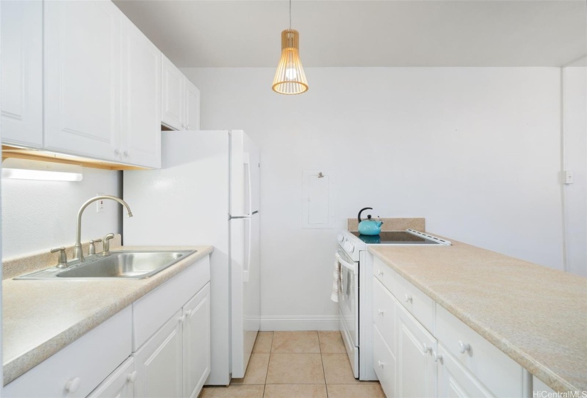 Galley style kitchen with fridge and range/oven replaced in 2022