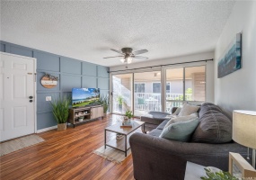 Custom TV Wall & Beautiful Flooring with an Open Floor Plan perfect for Dining & Entertaining make this Ewa Beach home a true charmer!