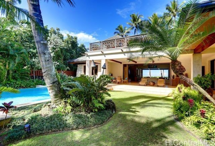 View of pool looking onto open lanai in main dwelling.