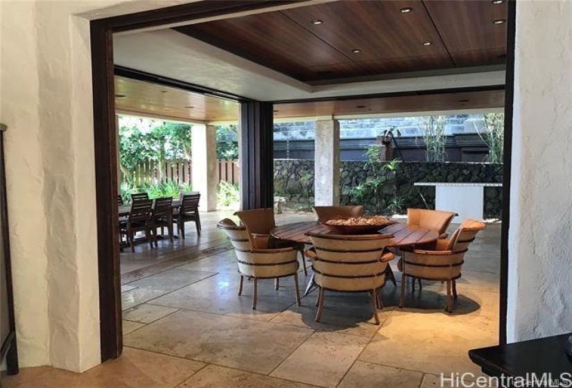 Main dwelling dining area...beautiful coconut and leather dining table! Separate Teak dining table, seats 10, is right outside.