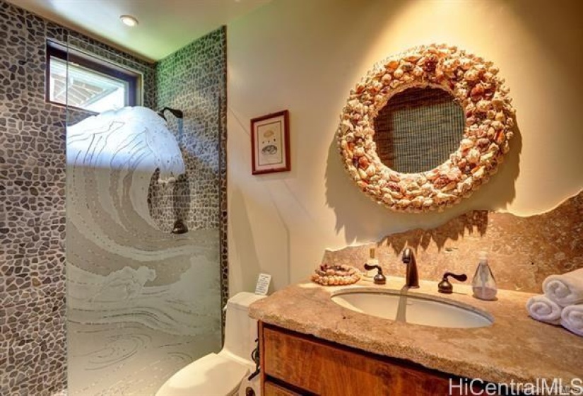 Walk in from the beach to this bath! Just outside of this bath is an outside shower to rinse off the sand.