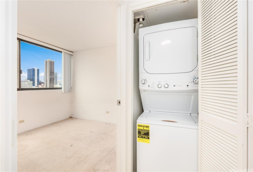 The convenient washer dryer is just outside the 3rd bedroom.