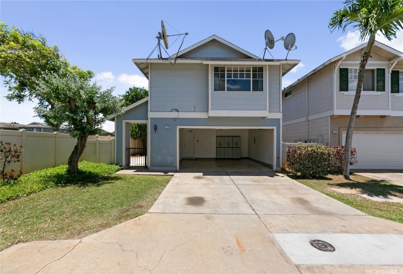 Front view of the house with the garage opened