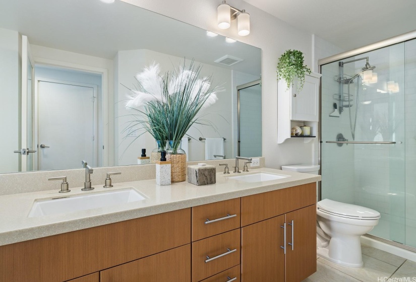 The primary bathroom has a shower and double vanities.