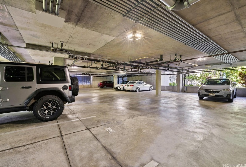 There are 2 covered parking spaces near the elevator.