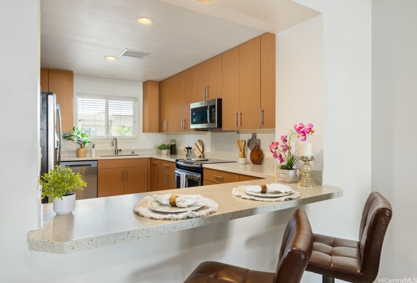 The eat in counter is convenient for quick meals or as a pass-through for the dining table.