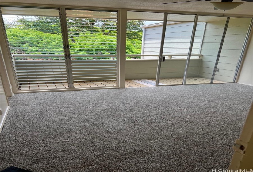 Primary  bedroom has new carpet and covered lanai.