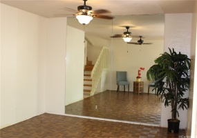 Living room with floor to ceiling mirror makes it bright.