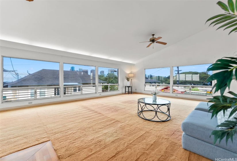 Extra high vaulted ceilings make this extra large living area feel even larger!