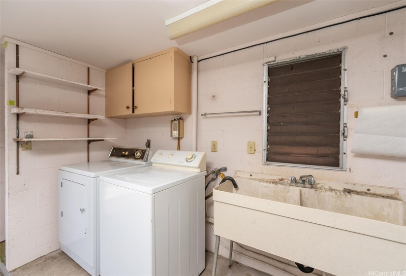 Laundry area is located in the enclosed garage for added convenience.