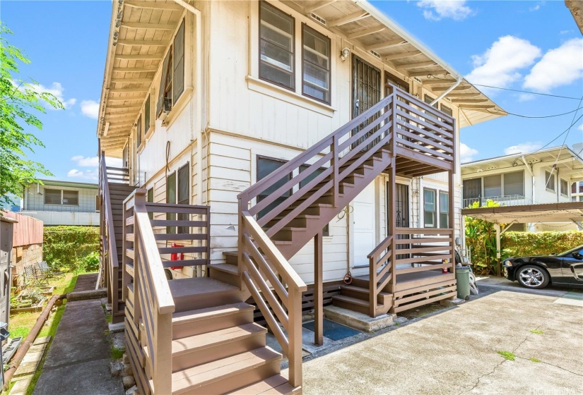 Back apartment building with new staircases.