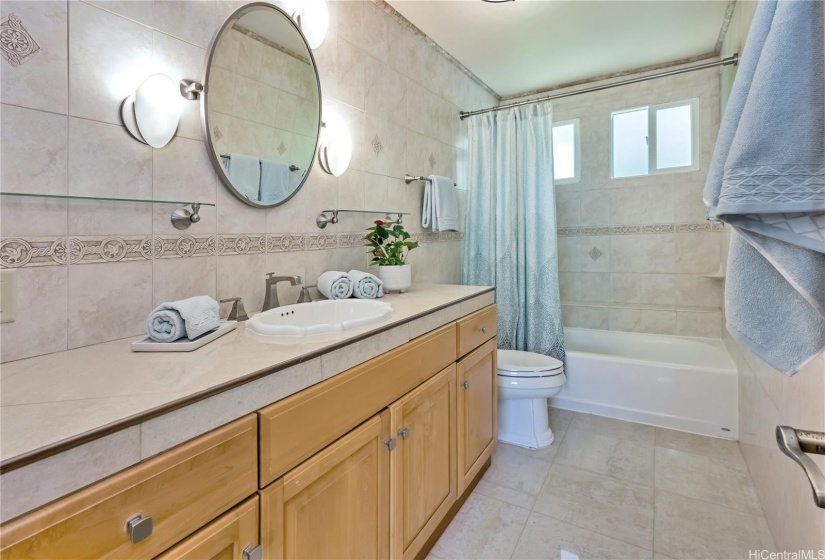 A second spacious bathroom is also beautifully tiled.