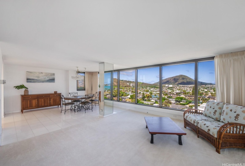 A seamless flow from your living room to the formal dining area with scenic backdrop of Koko Head and the marina.