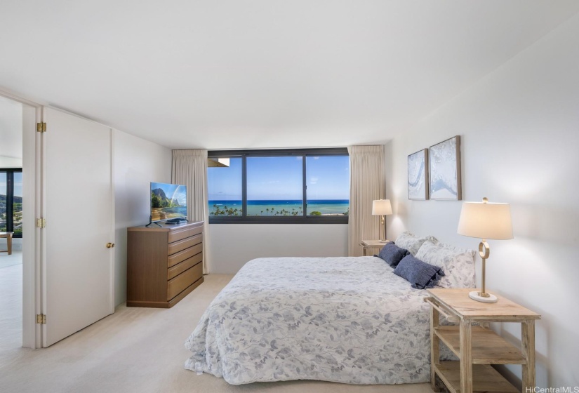 Primary bedroom with serene ocean views.