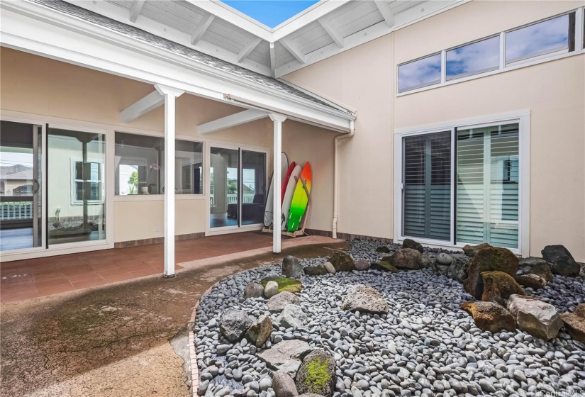 Indoor atrium with a covered lanai for indoor/outdoor entertaining