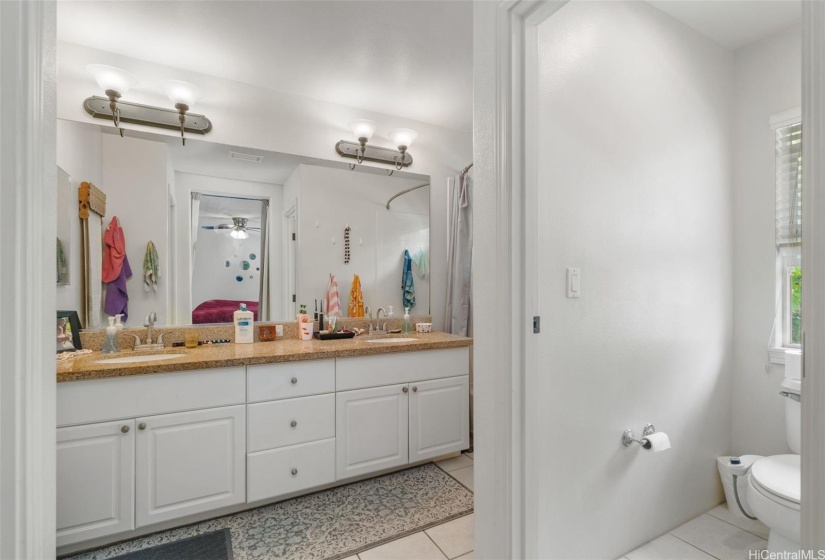 Main bathroom with separate toilet.