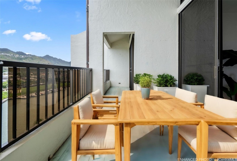 Enhanced photo. Create your own outdoor oasis on a lanai with gorgeous sunset & Diamond Head views overlooking the Hawaii Kai marina.