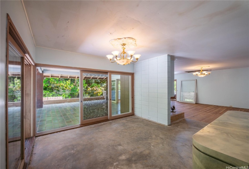 Dining room off of the living room and beautifully tiled lanais.