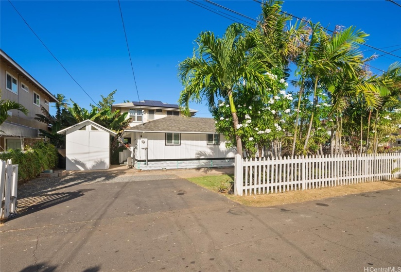 Charming home complete with a white picket fence and parking for 2-3 vehicles.