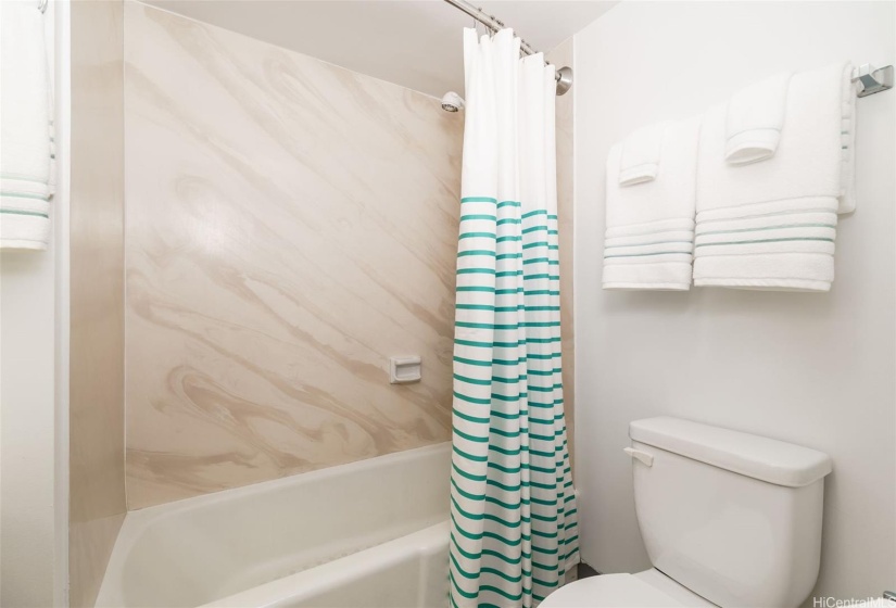 The hallway bath also includes a combination tub and shower.