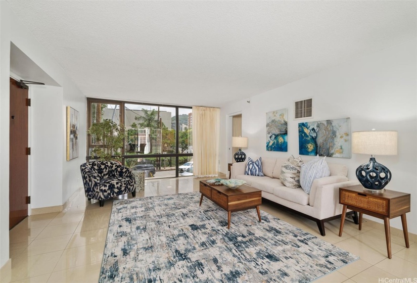 floor-to-ceiling windows flood the rooms with natural light, creating an expansive and open living area.