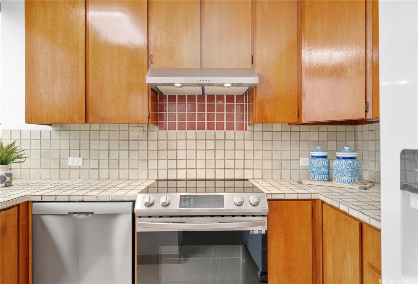 Kitchen featuring a new dishwasher, newer appliances, and refinished solid wood cabinets.