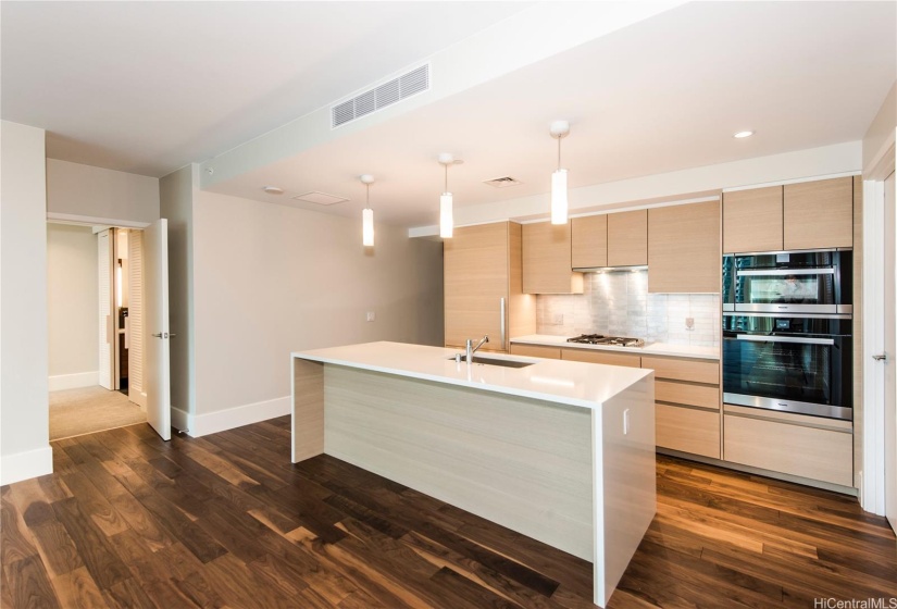 Rare combination of walnut flooring and light oak cabinetry