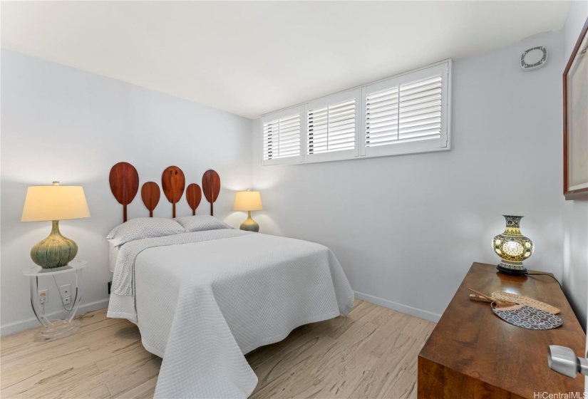 Custom canoe paddle headboard and plantation shutters