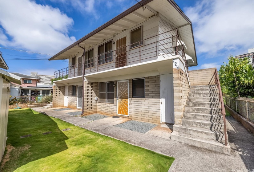 Two-story apartment building with four 1BD/1BA units.